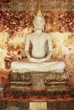 Statues of buddha with rusty wall background Stock Photos