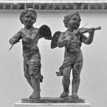 Statues of cherub musicians Stock Photos