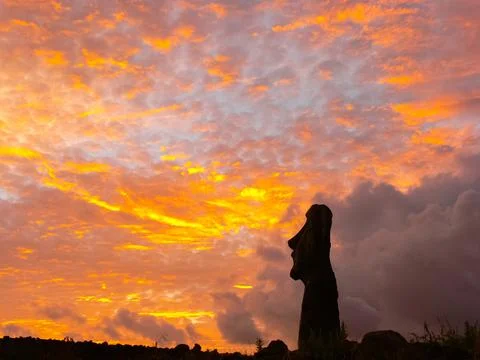 Statues of Easter Island in the background of the sunset. melting of the East Stock Photos