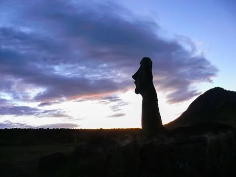 Statues of Easter Island in the background of the sunset. melting of the East Stock Photos