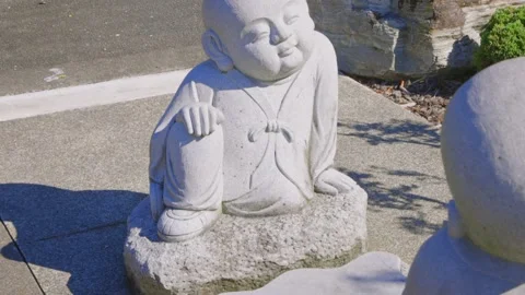 Statues in the garden of a buddhist temple Stock Footage 152502296