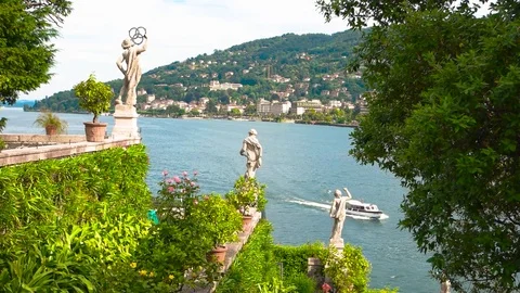 Statues on Maggiore lake background. Stock Footage