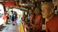 Statues of monks at Pattaya floating market. HD Footage