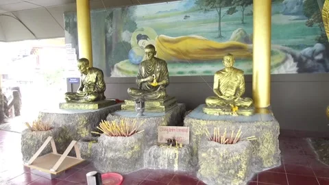 Statues of monks at A view at Khao Tao Temple, Hua Hin, Thailand Stock Footage 130700237