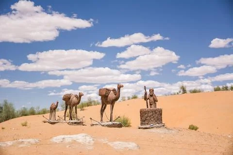 Statues representing a small caravan of camels Stock Photos
