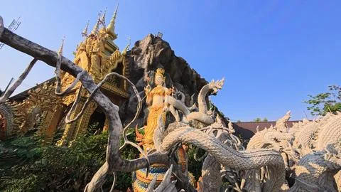 Statues in a Thai buddhist temple. Stock Photos