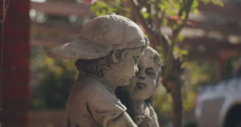 Statues of young children sitting Stock Footage 204124711