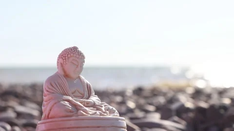 Statuette of Buddha on the beach Stock Footage 137152724