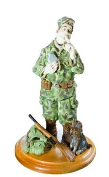 Statuette of hunter with flask Stock Photos