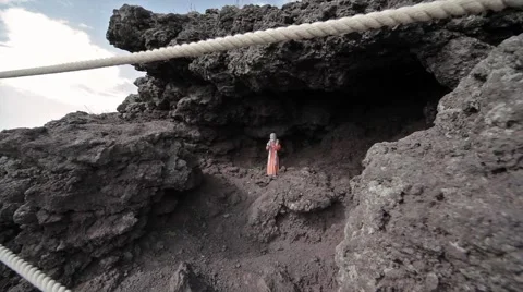 A statuette of a saint on Vesuvius. Stock Footage 68031891