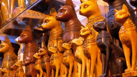 Statuettes of Egyptian Cats of Stone and other Products on Store Shelves in Video stock 106907675