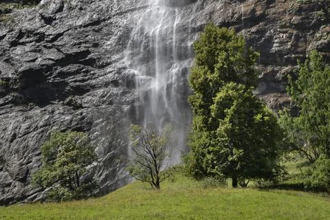 Staubbach falls dropping water down vertical rock face 스톡 사진