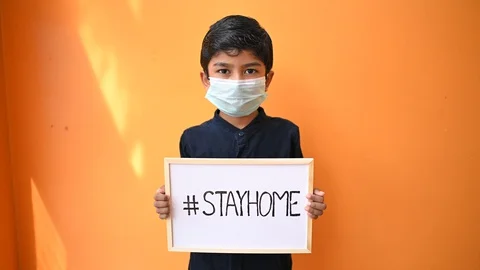 Stay at home .Coronavirus covid-19 infected.Asian Boy Wearing Masks and show Stock Footage 129346653
