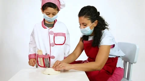Stay at home - Young mom and toddler pressing on a Pizza dough Stock Footage