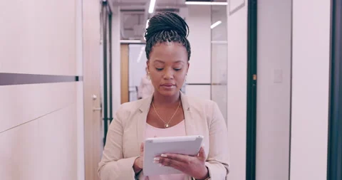 Stay mobile, keep moving forward. 4k video footage of a young businesswoman Stock Footage 201111667