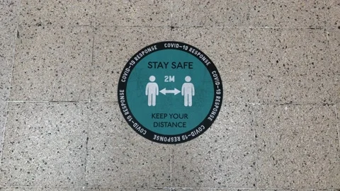 A stay safe and keep your distance floor sign. London UK. Stock Footage 142329325