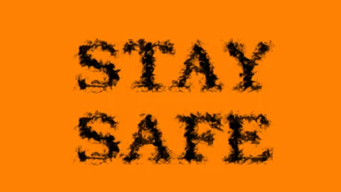 Stay Safe smoke text effect orange isolated background Stock Footage 139627104