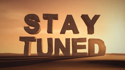 Stay Tuned Giant Eroded Stone Letters Standing in a Desert at Sunset with Stock Footage 341854955