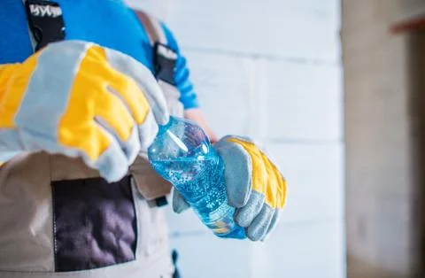 Staying Hydrated at Work. Body Hydration on the Construction Site. Stock Photos