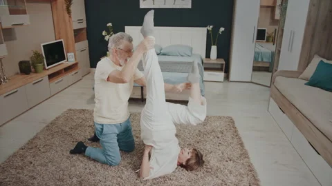 Staying Physically Active at Any Age with Home Exercise Vídeo Stock 327539645