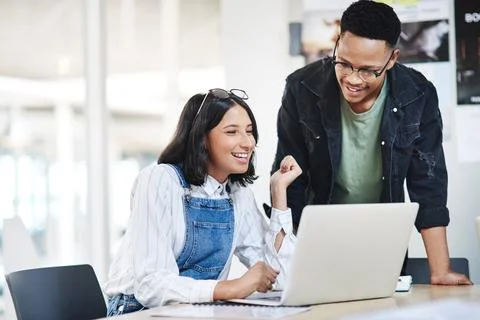 Staying on top of and adapting to developing trends. two businesspeople working Foto stock