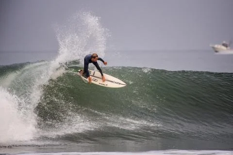 Staying on top of the wave. Stock Photos