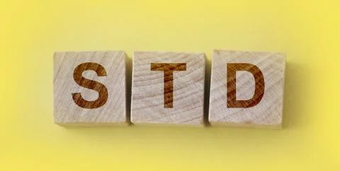 STD Sexually transmitted infections text on wooden cubes. Healthcare concept 库存照片