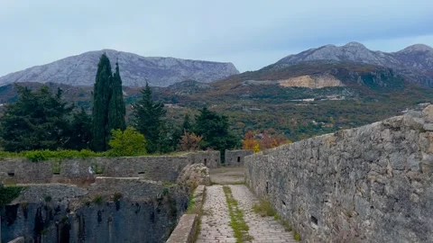 Steadicam movement forward along Spanjola Fortress wall in Herceg Novi Stock Footage 342540841