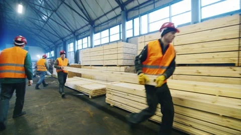 Steadicam shot: Builders are building materials, put them in a stack Stock Footage 61947567