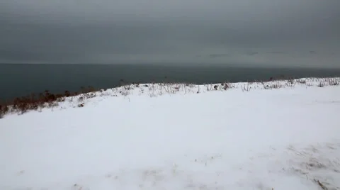 Steadicam shot of an extremely cold ocean coast Stock Footage 34008786