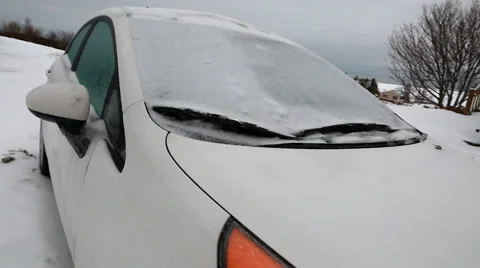 A steadicam shot of a frozen car in the snow Stock Footage 34094271