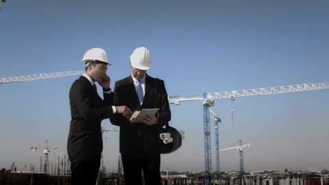 Steadicam shot of skyline and cranes, Asian construction/ executive/ architect/ Stock-Footage 199631006
