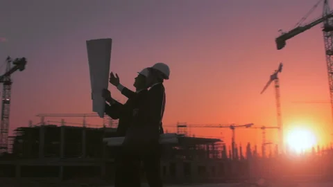 Steadicam shot of skyline and cranes with Asian construction/ executive/ archite Stock-Footage 199631091