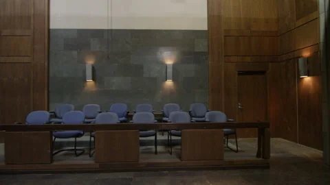 A steadicam view of interior modern court room for trial Stock Footage 259402967