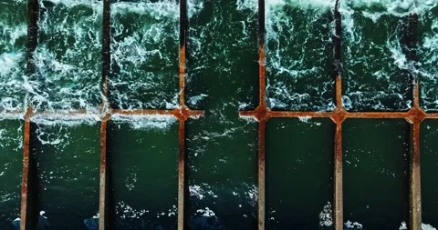 Steady Aerial Perspective Of Wave Breaking Concrete Structure On Eastern Stock Footage 300445046