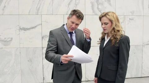 Steady-Cam Slow Motion Of Angry Businessman Scolding His Female Colleague Stock Footage 35254116