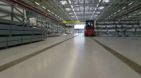 Steady cam walking through a storage warehouse in a factory. Stock Footage 63010318