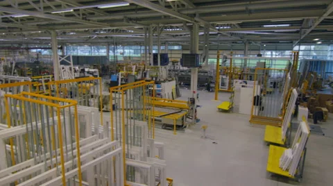 Steady cam walking through a storage warehouse in a factory. Video stock 63023596