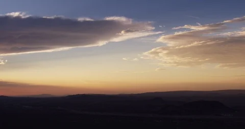 Steady cloudy aerial over mountains at sunset Video stock 105333387