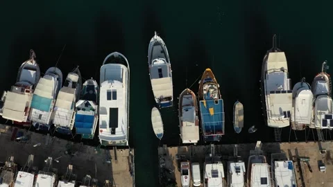 Steady drone view of the port in top down angle, boat approaching the port. Stock Footage 245933844