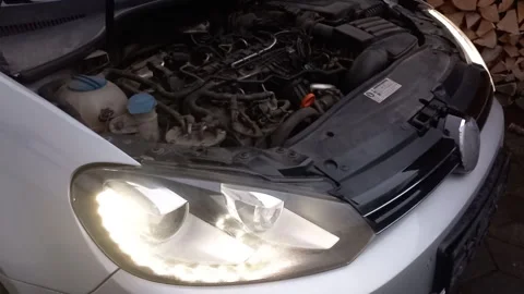 Steady Engine Idle with Alternating Headlight Clicks and Beam Shifts_Close-up on 動画素材 338170315