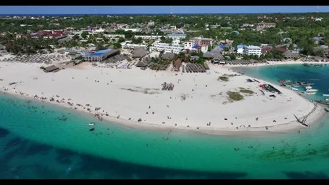 Steady flight with left panning in front of Kendwa Beach area with white sand Stock Footage 289064006