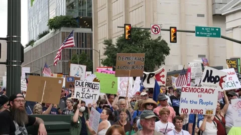 A steady flow of protesters march past 12th street in Richmond Virginia for the Video stock 311617312