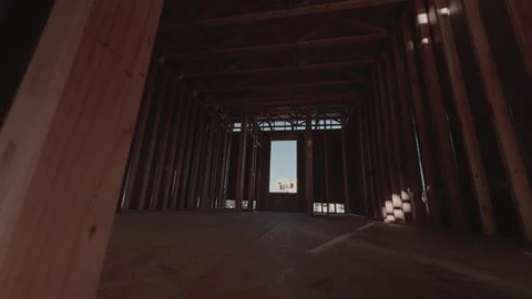 Steady Forward Glide Through Wooden House Framing Interior 库存影片 334577883