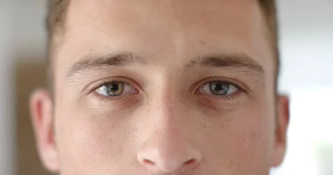 Steady gaze and micro-blinks are causing man to be blinking, smiling, and Stock Footage 344405324
