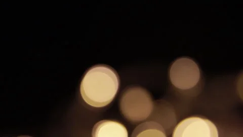 Steady golden lights from the left in the darkness Видео 309338177