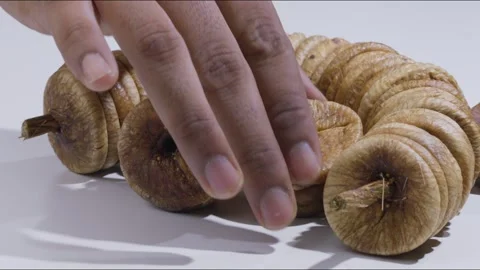 A steady mid close shot of a set of figs kept on a table Stock Footage 280337265