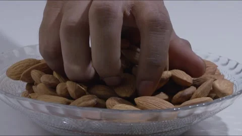 A steady mid-close shot of a set of almonds kept on a table 库存影片 280337566