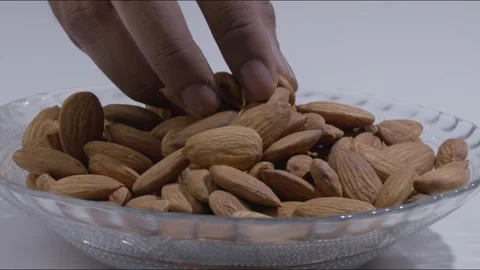 A steady mid-close shot of a set of almonds Stock Footage 280337657