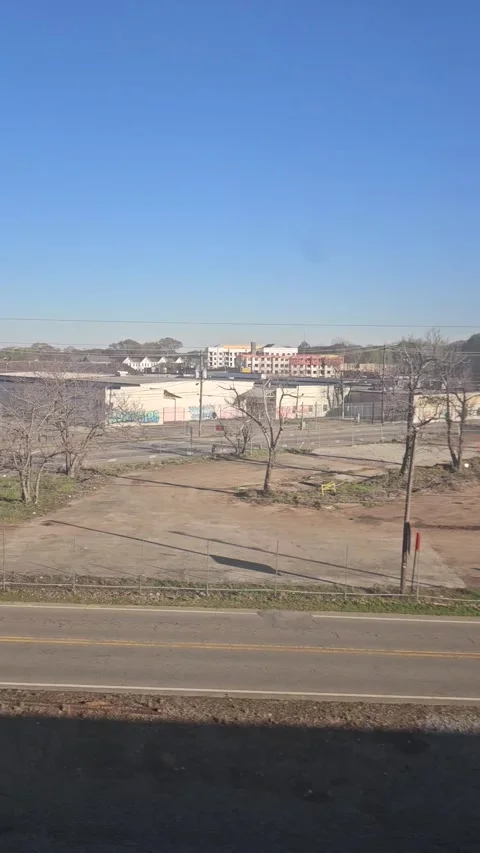 Steady Perspective of Metropolitan Transit Moving Through Urban Corridor Video stock 332606482